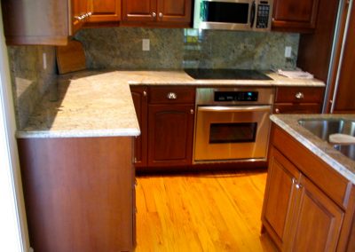 Cherry Kitchen with Granite counter top and back splash