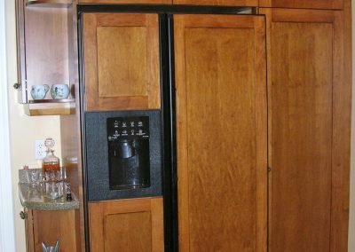 Maple Kitchen Continued showing Refrigerator and Pantry